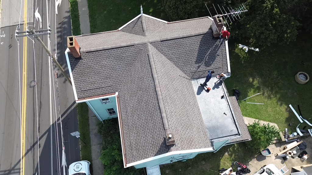 Trusted roofing contractor near me in Oakmont, PA working on residential shingles