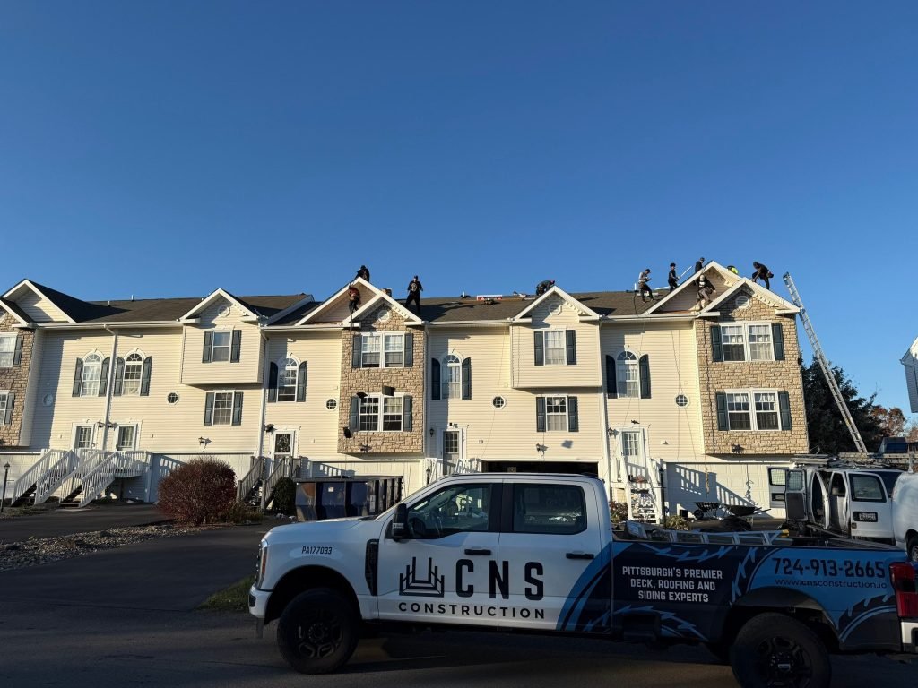 Expert roofing contractor in Monaca, PA installing a new shingle roof
