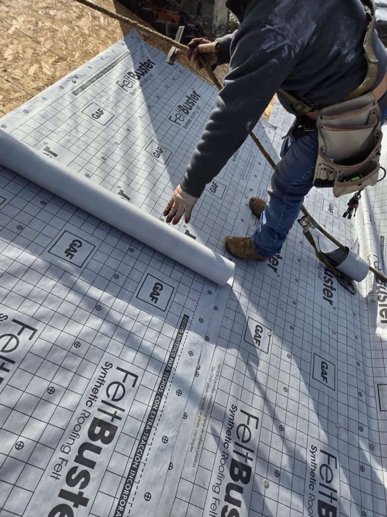 Local roofing contractor in Aliquippa, PA replacing damaged shingles